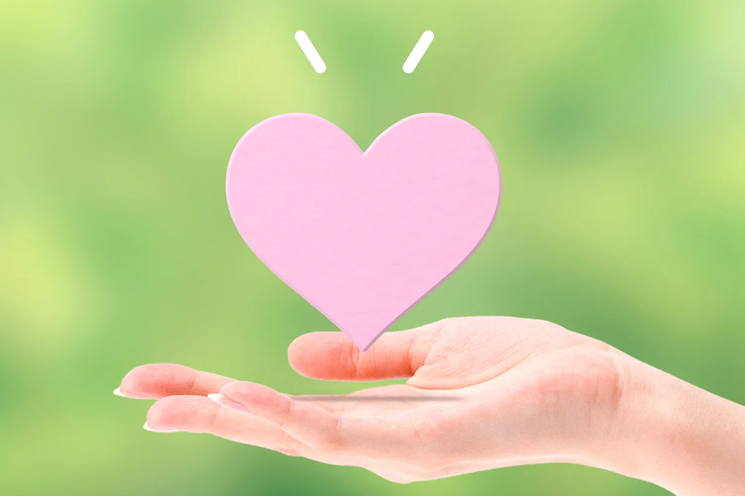 手のひらの上に浮かぶハートのイメージ画像